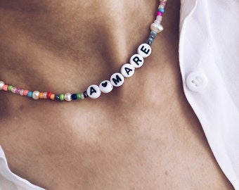 Necklace with natural pearls, multicolor beads and letters to compose