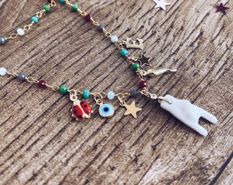 Multi-charm rosary necklace with lucky charms