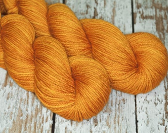 Hand Dyed KM Worsted Superwash Merino Wool Yarn in warm gold