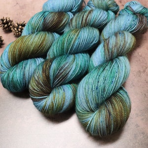Coastside Sock Merino Hand Dyed Yarn In Blue, Brown, and Green