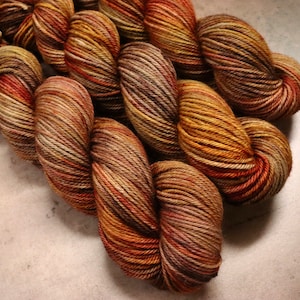 Hand Dyed Yarn KM Worsted Superwash Merino Wool Tones of Brown, Orange Red, and Gold
