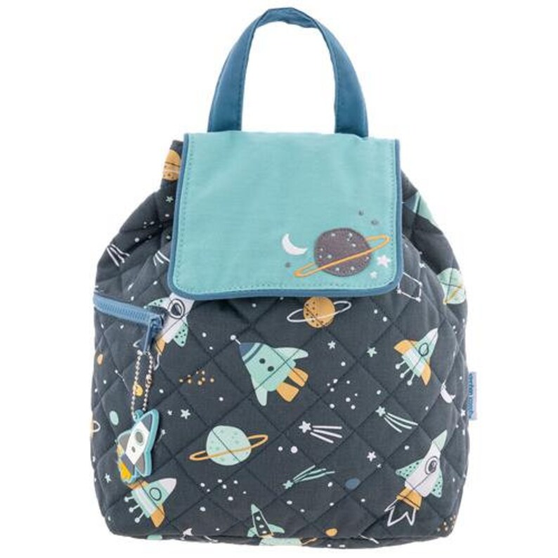 May include: A space-themed quilted backpack. The dark grey bag features a pattern of rockets, planets, and stars in blue, yellow, and white. It has a teal flap and handle, and a small rocket-shaped zip pull. The bag is approximately 25 cm high.