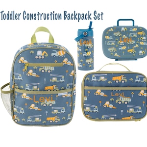 May include: A blue toddler construction backpack set with a lunch bag, water bottle, and backpack. The set features a construction vehicle pattern with the name "Levi" embroidered on each piece.
