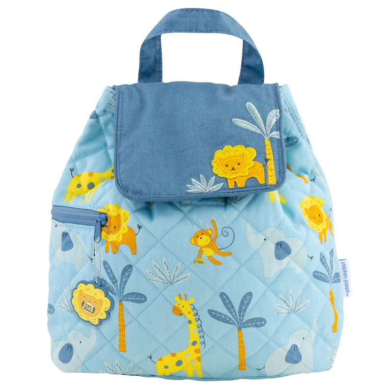 May include: Light blue quilted backpack with a jungle animal print. Features a top handle, front zip pocket, and flap closure. The design includes lions, elephants, giraffes, and monkeys. The backpack has a tag that says "ROAR".