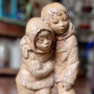 Hand carved sculpture: Inuit Boy and Girl. Signed and dated 1973