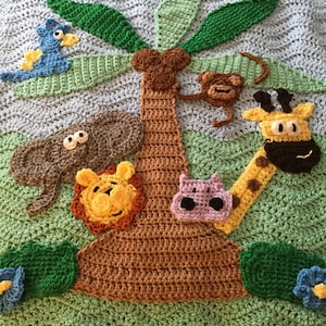 May include: A crocheted baby blanket with a jungle theme. The blanket features a brown tree with green leaves, a blue bird, a brown monkey, a gray elephant, a yellow lion, a purple hippopotamus, and a yellow giraffe.