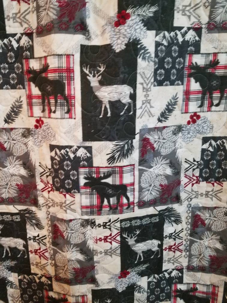 Super snuggle flannel quilted woodland baby quilt.
