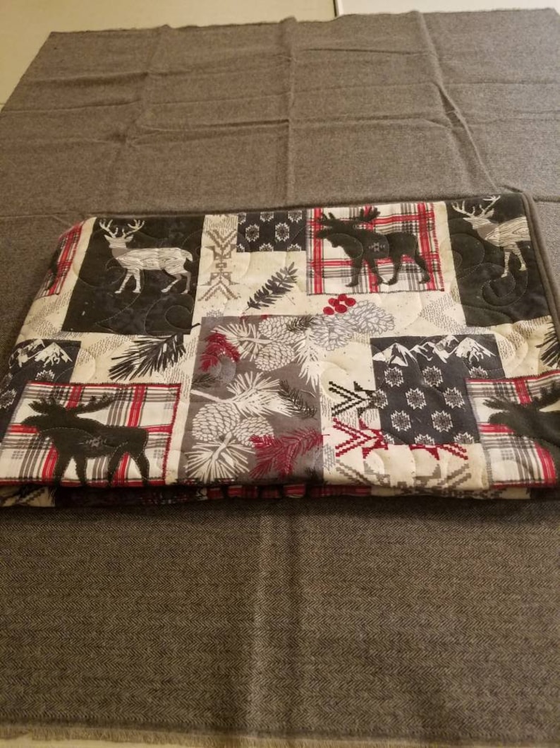 Super snuggle flannel quilted woodland baby quilt.