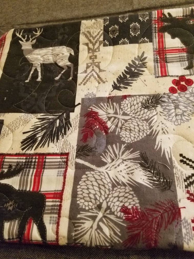 Super snuggle flannel quilted woodland baby quilt.