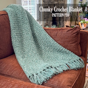 May include: A chunky crochet blanket with a textured sage green yarn finish and fringe detailing along the bottom edge. The image includes the text overlay Chunky Crochet Blanket PATTERN PDF, indicating this is a digital document for crafting.
