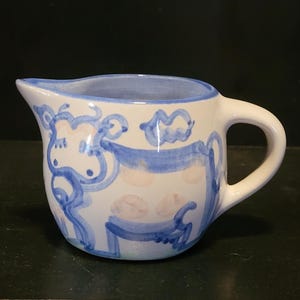 vintage Mary Alice Hadley ( m.a. Hadley) cream pitcher with cow theme.
