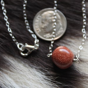 Dazzling goldstone pendant with sterling silver or 14 karat gold filled chain