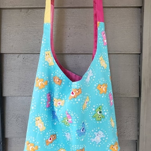Care Bear crossbody hobo bag, aqua, multi color Care Bear hobo bag, Care Bear bag, Care Bear slouch bag, reversible character bag, handbags
