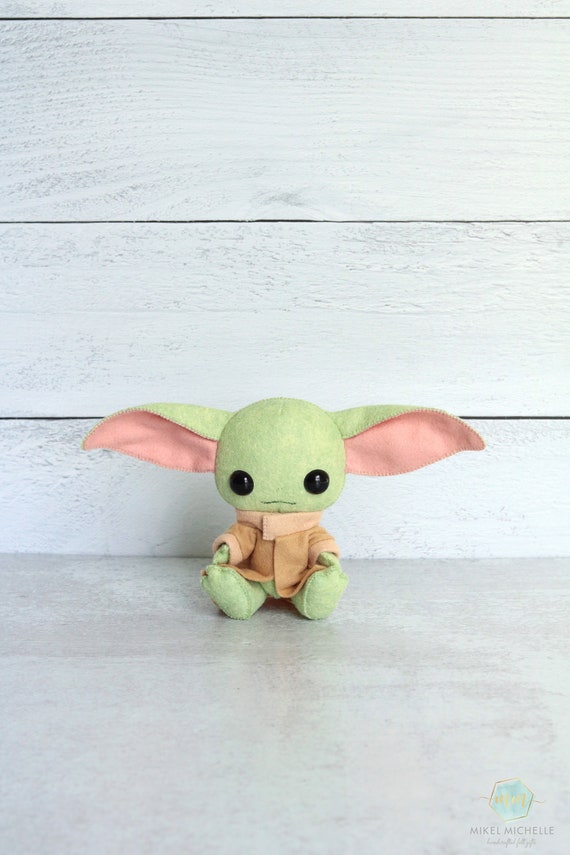 green alien doll