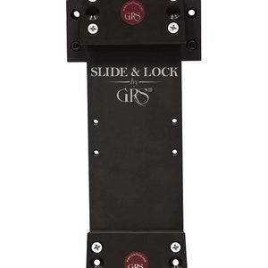 May include: Black metal slide and lock mechanism with a brass knob. The mechanism is labeled "SLIDE & LOCK by GRS".