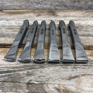May include: Six metal tire levers with black handles and silver tips. The levers are labeled with the numbers RF-101 through RF-106.