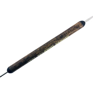 May include: A wooden double-ended tool with two pointed metal tips. The tool is labeled "Remarker Tools USA DBS".