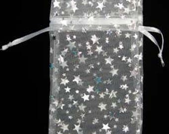 May include: White sheer organza gift bag with a drawstring closure. The bag is decorated with a silver glitter star pattern.