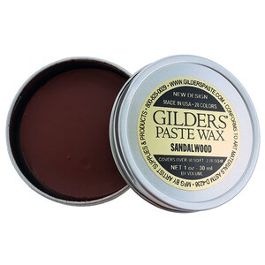 May include: A small tin of GILDERS PASTE WAX in the color Sandalwood. The tin is silver with black text and a gold label. The label says "New Design, Made in USA, 28 Colors, Covers over 18 sq ft, Net 1 oz, 30 ml by Volume".