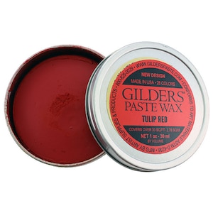 May include: A small tin of Gilder's Paste Wax in Tulip Red. The tin is labeled with the brand name, product name, and color. It covers over 30 square feet and contains 1 ounce of wax.