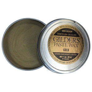May include: A round tin of Gilders Paste Wax in gold. The label reads "Gilders Paste Wax Gold" and "Covers over 30 sq/ft - 2.78 sq/m. Net 1 oz - 30 ml by volume."