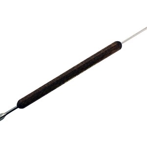 May include: A wooden handled tool with a pointed metal tip. The tool is used for crafting and art projects.