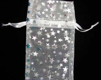 May include: White organza gift bag with a silver star pattern and a white satin ribbon.