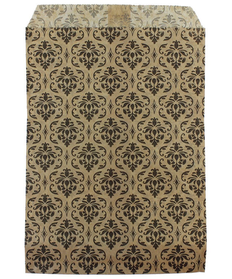 May include: A brown paper bag with a black damask pattern. The bag is flat and has a square shape.