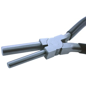 May include: Close-up of a silver-toned jewelry pliers with black rubber handles. The pliers have two long, parallel arms that are used to crimp or close jump rings.