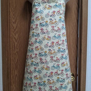 Plus size women&#39;s apron. Vintage bicycles