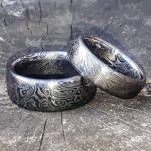 A Pair of Aegir Handforged Stainless Damascus Steel Rings