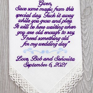 Puede incluir: Un pa&ntilde;uelo blanco con un mensaje bordado en morado que dice "Gwen, Save some magic from this special day Tuck it away while you grow and play. It will be here waiting when you are old enough to say I need something old for my wedding day" y "Love, Bob and Se&ntilde;orita September 6, 2021".