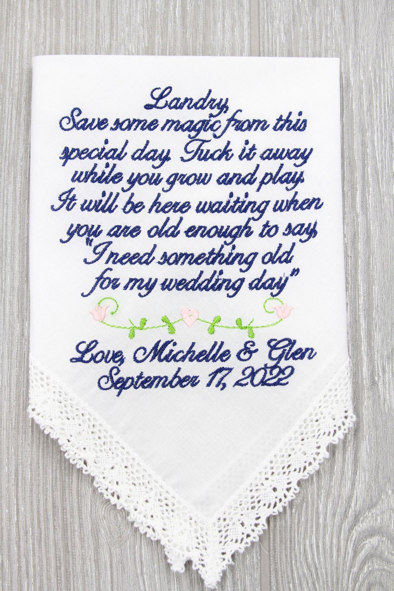 Puede incluir: Pa&ntilde;uelo blanco con texto bordado en azul que dice "Landry Save some magic from this special day Tuck it away while you grow and play It will be here waiting when you are old enough to say "I need something old for my wedding day" Love, Michelle & Glen September 17, 2022".