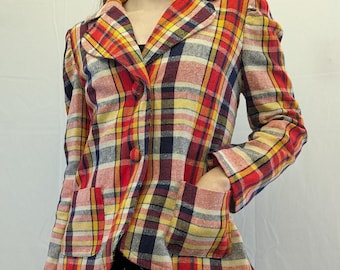 May include: A vintage plaid blazer in red, yellow, and navy blue. The blazer features a classic collar, two front pockets, and a two-button closure. The sleeves have a slight puff at the shoulders. The plaid pattern is a mix of warm and cool tones.