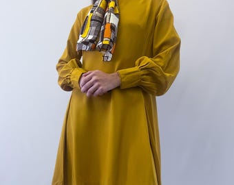 1960s Mustard Yellow Long Sleeve A-Line Mini Dress With Mock Neck, Balloon Sleeves, and Front Pleats