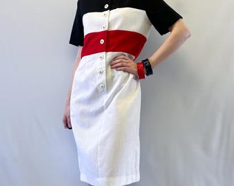 Vestido Melissa Petites de los años 80, color blanco, negro y rojo, con bloques de color y botones en la parte delantera.