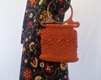 1970s Orange Macrame Bag With Oversized, Round, Translucent Brown Handles and Geometric Accents