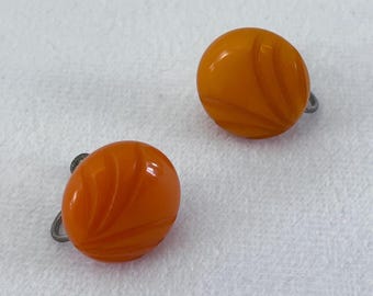 1930s or 1940s Orange and Yellow Toned "Butterscotch" Bakelite Screwback Button Earrings With Carved Art Deco Design