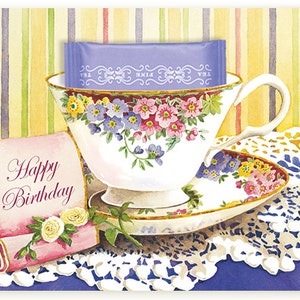 Cartão de feliz aniversário com um saquinho de chá de Paris enfiado dentro de um cartão ilustrado em aquarela, de Kimberly Shaw
