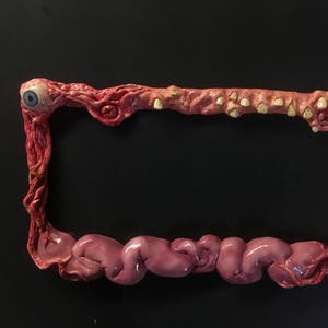 Guts license plate frame anime horror