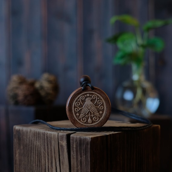 Tribal Style Blackbird Wooden Necklace/Pendant. Made from solid sycamore wood. Round shape. Brown color. Adjustable cotton cord.