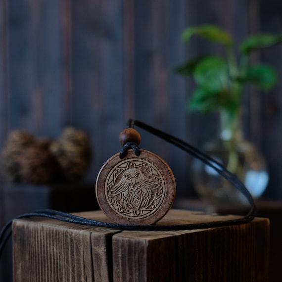 Celtic Style Falcon Bird Necklace/Pendant. Made from solid sycamore wood. Round shape. Brown color. Adjustable cotton cord.