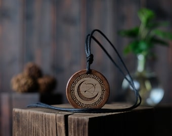 Goddess Artemis Necklace/Pendant. Made from solid wood. Brown colour, round shape. Adjustable black cotton cord.