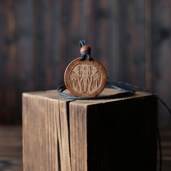 Elephant Necklace/Pendant. Made from solid sycamore wood. Round shape. Brown color. Adjustable cotton cord. Personalization