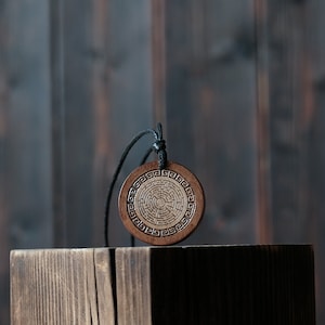 Labyrinth  Necklace/Pendant. Made from solid wood. Brown colour, round shape. Adjustable black cotton cord.