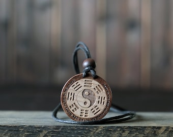 Taekwondo Necklace/Pendant, Martial Art Necklace. Made from solid sycamore wood. Round shape. Brown color. Adjustable cotton cord.