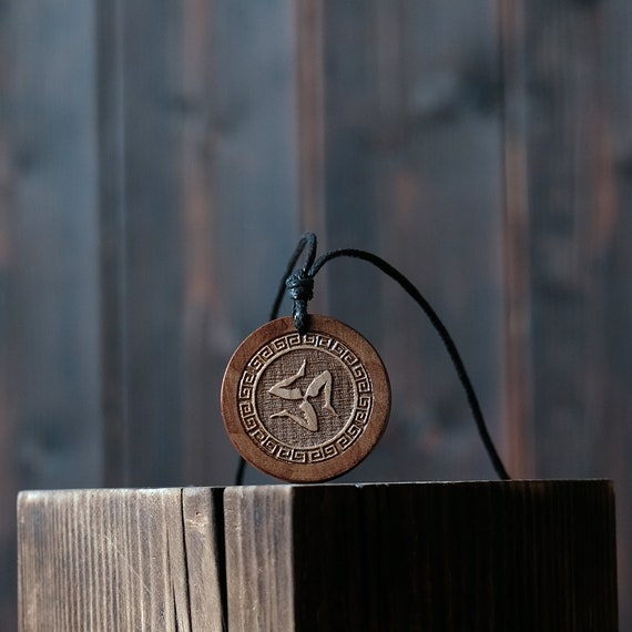 Trinacria Necklace/Pendant. Made from solid wood. Brown colour, round shape. Adjustable black cotton cord.