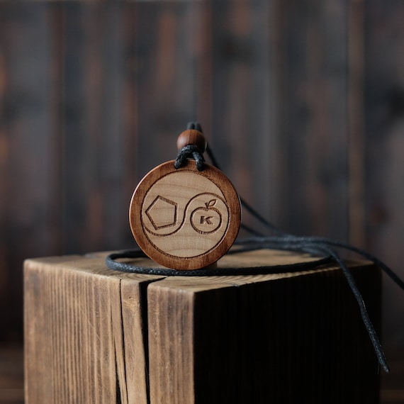 Discordian Sacred Chao Necklace/Pendant. Made from solid sycamore wood. Round shape. Brown color. Adjustable cotton cord. Text customization