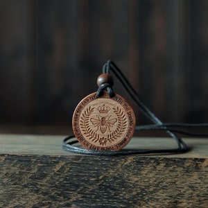 Napoleon Bonaparte Necklace/Pendant. Made from solid sycamore wood. Round shape. Brown color. Adjustable cotton cord. Text customization.