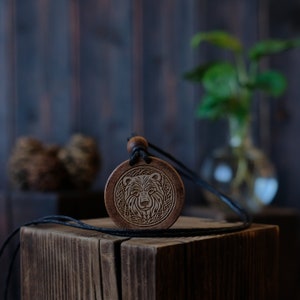 Celtic Style Bear Wooden Necklace/Pendant. Made from solid sycamore wood. Round shape. Brown color. Adjustable cotton cord.